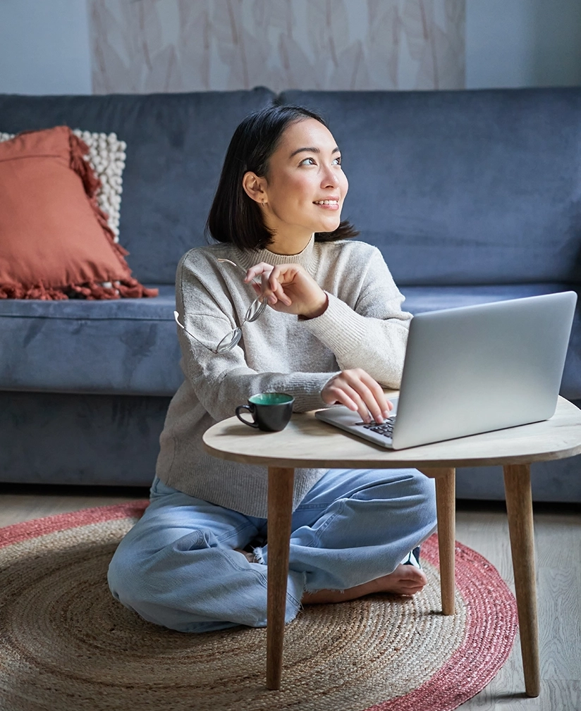 vertical shot asian girl sits floor home